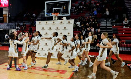 Oxford&rsquo;s players rush the court to accept the 2025 Calhoun County Tournament champion&rsquo;s trophy. (Photo by Joe Medley/East Alabama Sports Today)