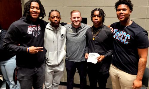 Oxford football signees (from left) Desmond Whitson, D.K. Wilson, Cedric Twyman and Markevion Conley pose for a picture with Oxford coach Sam Adams during Thursday&rsquo;s ceremony to celebrate their college signings &hellip; Wilson and Twyman with Harding University, Whitson with Clark-Atlanta University and Conley with Mississippi Community Christian College. (Photo by Joe Medley/East Alabama Sports Today)